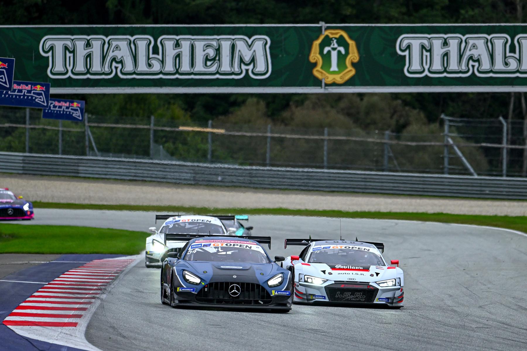 GT cars racing on track at Red Bull Ring during the 2024 season.